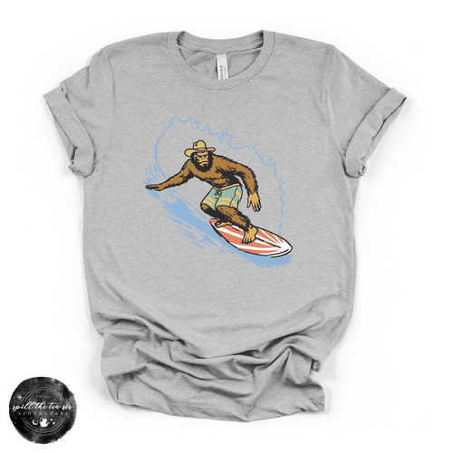 Surfing Bigfoot Tee | Funny Beach Sasquatch Graphic T-Shirt