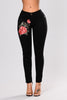 Black jeans with embroidered feet