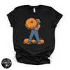 Bigfoot Carrying Pumpkin Tee | Funny Sasquatch Fall Graphic T-Shirt