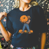 Bigfoot Carrying Pumpkin Tee | Funny Sasquatch Fall Graphic T-Shirt