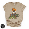Pumpkin Head Bigfoot on a Crocodile Tee | Funny Cryptid Halloween Graphic T-Shirt
