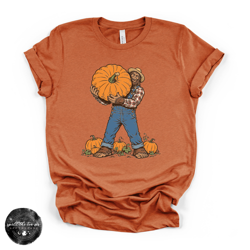 Bigfoot Carrying Pumpkin Tee | Funny Sasquatch Fall Graphic T-Shirt