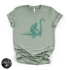 Bigfoot Riding Nessy Tee | Funny Cryptid Graphic T-Shirt