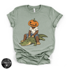 Pumpkin Head Bigfoot on a Crocodile Tee | Funny Cryptid Halloween Graphic T-Shirt