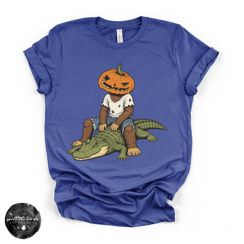 Pumpkin Head Bigfoot on a Crocodile Tee | Funny Cryptid Halloween Graphic T-Shirt